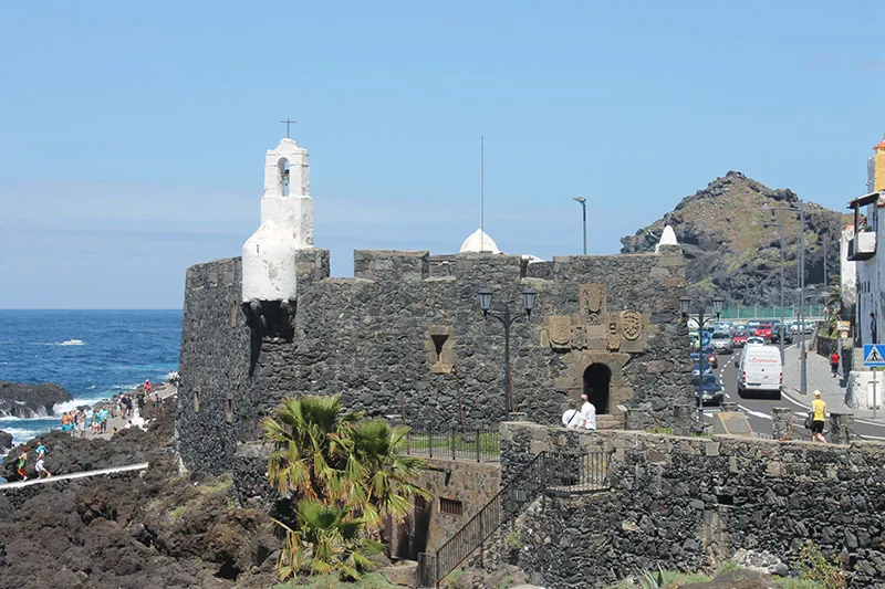 The dark-stone Castillo de San Miguel overlooking the sea in Garachico