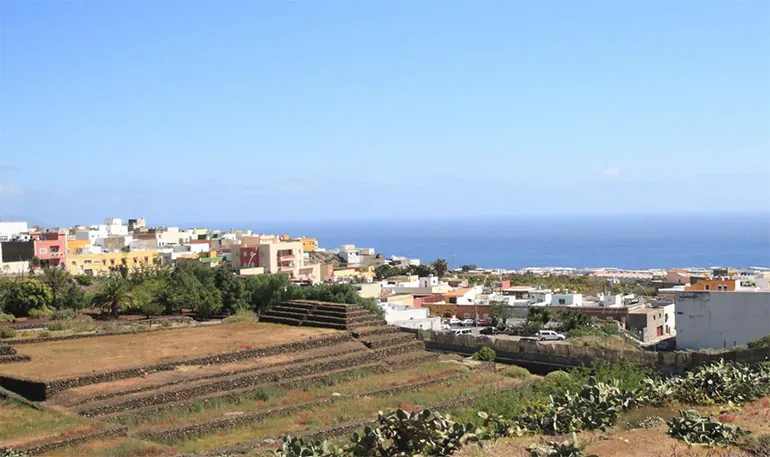 Stepped pyramids and prickly pears in front of Güímar’s houses, with the sea on the horizon