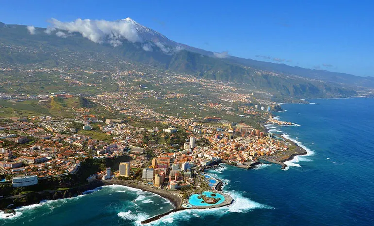 Puerto de la Cruz from above, with Lago Martiánez on the coast and Mount Teide