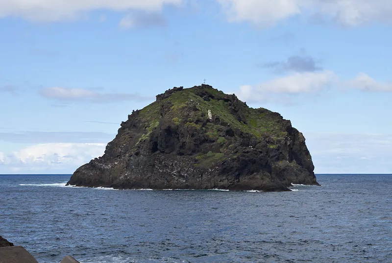The Roque de Garachico out at sea, a volcanic islet with a cross on its summit
