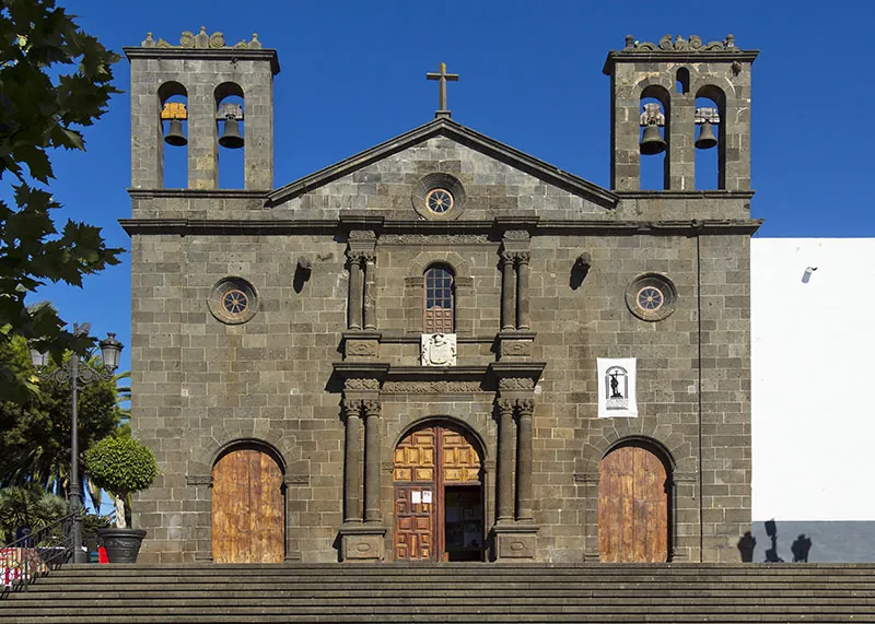 Black-stone façade and two bell towers of the Santuario del Santísimo Cristo de Tacoronte